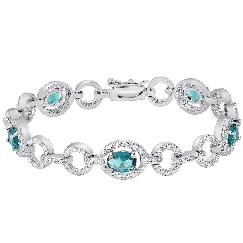 Silver cuff bangles for women-Dolce Giavonna Silver Overlay Simulated London Blue Topaz and Diamond Accent Oval Link Bracelet