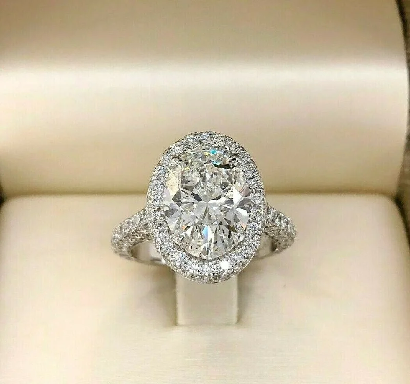 Elegant wedding rings for brides-5.46 Carats t.w. Oval Cut Diamond Puffed Halo 3 Sided Pave Engagement Ring Plat