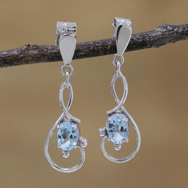 stylish hoop earrings for women -Beauty Swirls Rhodium Plated Blue Topaz Dangle Earrings from India